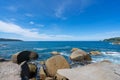 Rocky seashore under clear blue sky with clouds in the morning Summer sunny day background Beautiful Sea in Phuket Thailand Royalty Free Stock Photo