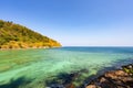 Rocky seashore under clear blue sky with clouds in the morning Summer sunny day background Beautiful Sea in Phuket Thailand Royalty Free Stock Photo