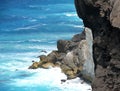 Rocky seaside with surf.