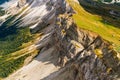 Rocky Seceda ridgeline against green valley in Italian Alps