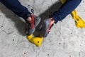 Rocky shoe on a tiny, scanty snare stands with the tip of the sock in close-up on the climbing wall in the room Royalty Free Stock Photo