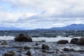 rocky shore of the Beautiful lakes in argentinian Lake District near Bariloche, Argentina Royalty Free Stock Photo