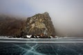 Rocky shore of lake Baikal in the fog in winter Royalty Free Stock Photo