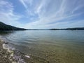 Rocky shore of Lake Solinskie visible mountains Bieszczady clear water