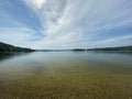 Rocky shore of Lake Solinskie visible mountains Bieszczady clear water