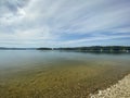 Rocky shore of Lake Solinskie visible mountains Bieszczady clear water