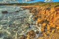 Rocky shore in Le Bombarde beach Royalty Free Stock Photo