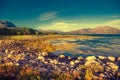 Rocky shore of mountain lake in autumn morning Royalty Free Stock Photo