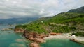 Rocky Shore In The Sea With Forest. Footage. Aerial