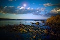 Rocky shoreline and clouds 1 Royalty Free Stock Photo