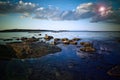 Rocky shoreline and clouds 2