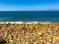 Rocky Shoreline and Deep Blue Ocean Royalty Free Stock Photo