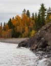 Rocky Shoreline of Lake Superior with Birch Trees in Autumn Royalty Free Stock Photo