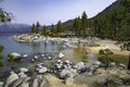 Rocky shoreline of Lake Tahoe and surrounding mountains