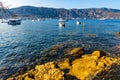 Rocky shoreline landscape of Saint-Jean-Cap-Ferrat resort town with sightseeing path on Cap Ferrat cape in France