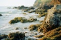 a rocky shoreline with waves crashing against the rocks Royalty Free Stock Photo