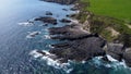 Rocky shores along the route of the Wild Atlantic Way, top view. Seascape of the southern coast of Ireland. Beautiful rocky slopes Royalty Free Stock Photo