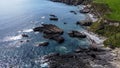 Rocky shores along the route of the Wild Atlantic Way, top view. Seascape of the southern coast of Ireland. Beautiful rocky slopes Royalty Free Stock Photo