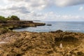 Rocky Shorline, Devil`s Tear, Nusa Lembongan, Bali. Rocks and tidepool in forground; Ocean, shorline, clouds, sky beyond.