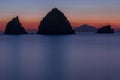 Rocky silhouettes in the Aegean Sea.