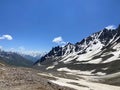 The rocky slopes of the northern Elbrus region. Snow peaks on the horizon Royalty Free Stock Photo