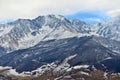 Rocky snow-capped mountains over the village of Fiagdon