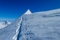 Lyskamm traverse knife edge snow ridge glacier walk and climb in the Alps Royalty Free Stock Photo