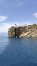 Rocky steep coast of the blue Mediterranean sea