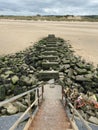 Rocky steps leading to a sandy beach