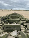 Rocky steps leading to a sandy beach