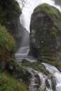 Rocky stream in a gorge aside of the waterfall Royalty Free Stock Photo