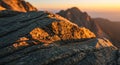 Rocky surface illuminated by the warm light of a sunrise or sunset, creating a striking Royalty Free Stock Photo