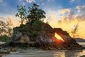 Rocky tropical coastline at sunset