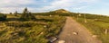 Violik hill with building on Snezne jamy on the background in evening Krkonose mountains on czech-polish borders Royalty Free Stock Photo