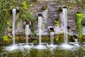Rocky wall with small waterfalls in Planten un Blomen park Royalty Free Stock Photo