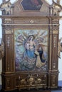 Rococo wooden altarpiece of the Virgin of the Rosary, San Andres church, Ibarrangelu, Basque Country, Spain.