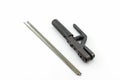 Rod-holder with Welding electrodes wire, for electric arc welding. Royalty Free Stock Photo