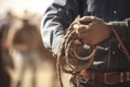 rodeo champion, holding the rope and wearing the hat in competition