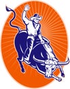 Rodeo cowboy riding jumping longhorn bull