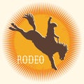 Rodeo wild horse vector symbol. Silhouette of Cowboy riding a wild horse on yellow sun in symbol flat style illustration isolated Royalty Free Stock Photo