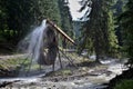 Rodna mountains in Romania - water wheel at Iza river source