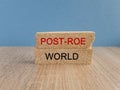 Roe vs Wade post-Roe world symbol. Concept words Post-Roe world on brick blocks on a beautiful wooden table