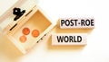 Roe vs Wade post-Roe world symbol. Concept words Post-Roe world on wooden blocks on a beautiful white background. Wooden chest