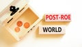 Roe vs Wade post-Roe world symbol. Concept words Post-Roe world on wooden blocks on a beautiful white background. Wooden chest