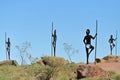Sculpture of Aboriginal Australian male standing on a rock on top of Mount Welcome near Roebourne Western Australia