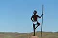 Sculpture of Aboriginal Australian male standing on a rock on top of Mount Welcome near Roebourne Western Australia