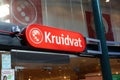 Closeup of red sign with logo lettering of dutch drugstore kruidvat over store entrance