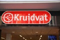 Closeup of red sign with logo lettering of dutch drugstore kruidvat over store entrance