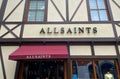 View on store facade with logo lettering of british fashion company allsaints