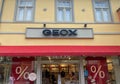 View on store facade with logo lettering of geox shoes